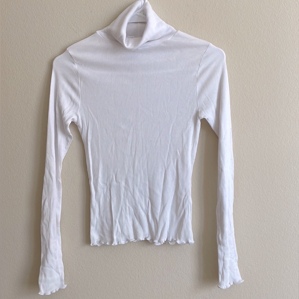 Turtleneck top.